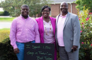 Hill-Jordan family on adoption day with sign: "I spent 1,156 days in foster care, but today...