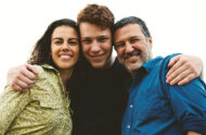 A teenage boy and two parents.