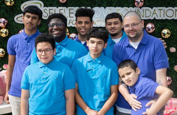 William Presswood and six children he's adopted from foster care.