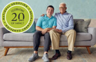 A teenager sits on a couch with his father as part of the 20th anniversary celebration of the Ad Council's partnership with AdoptUSKids and the Children's Bureau to create public service announcements about adopting teenagers from foster care.