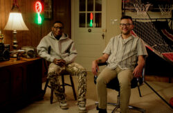 Stahl family sitting next to each other in room.